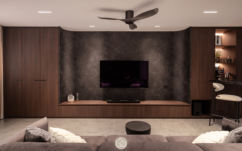 Dark textured feature wall providing visual privacy in living room.