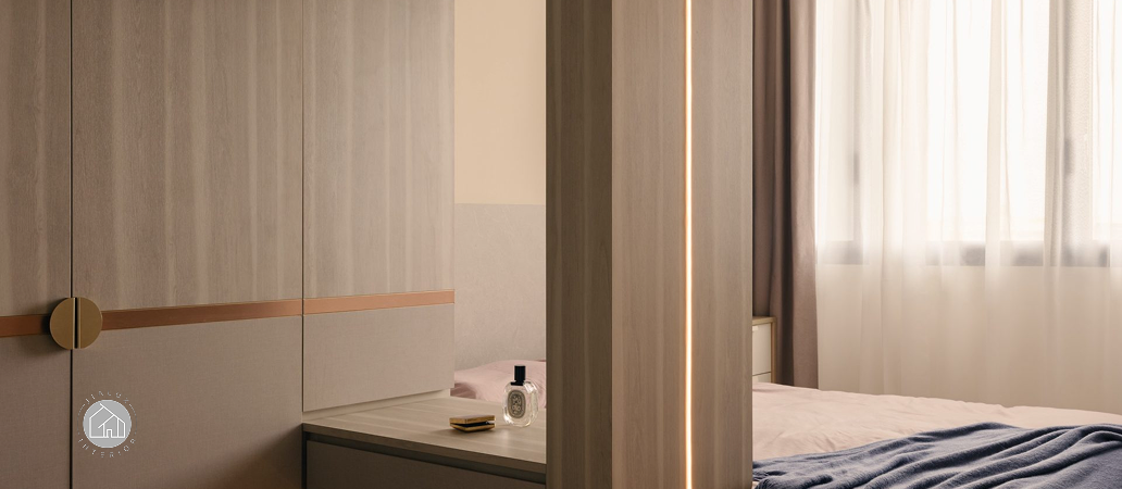 Luxury bedroom wardrobe with integrated LED lighting strip.