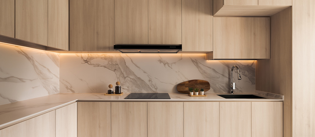 Eco-friendly kitchen renovation featuring wooden cabinets and marble.